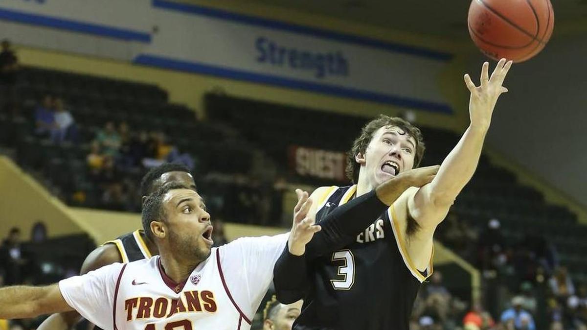 Wichita State’s Evan Wessel grabs for a loose ball against Southern California’s Julian Jacobs on Thursday.