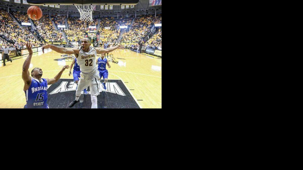 
Wichita State’s Tekele Cotton blocks a shot by Indiana State’s Tre Bennett.
