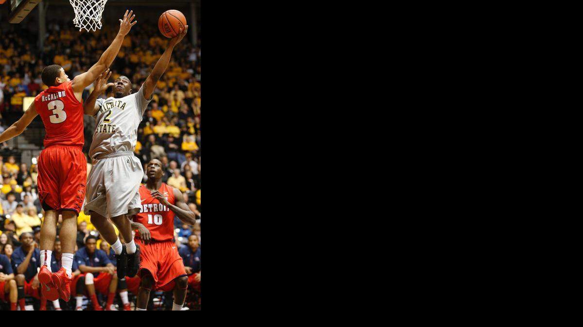 
Wichita State’s Malcolm Armstead shoots against Detroit’s Ray McCallum during a 2013 game at Koch Arena.
