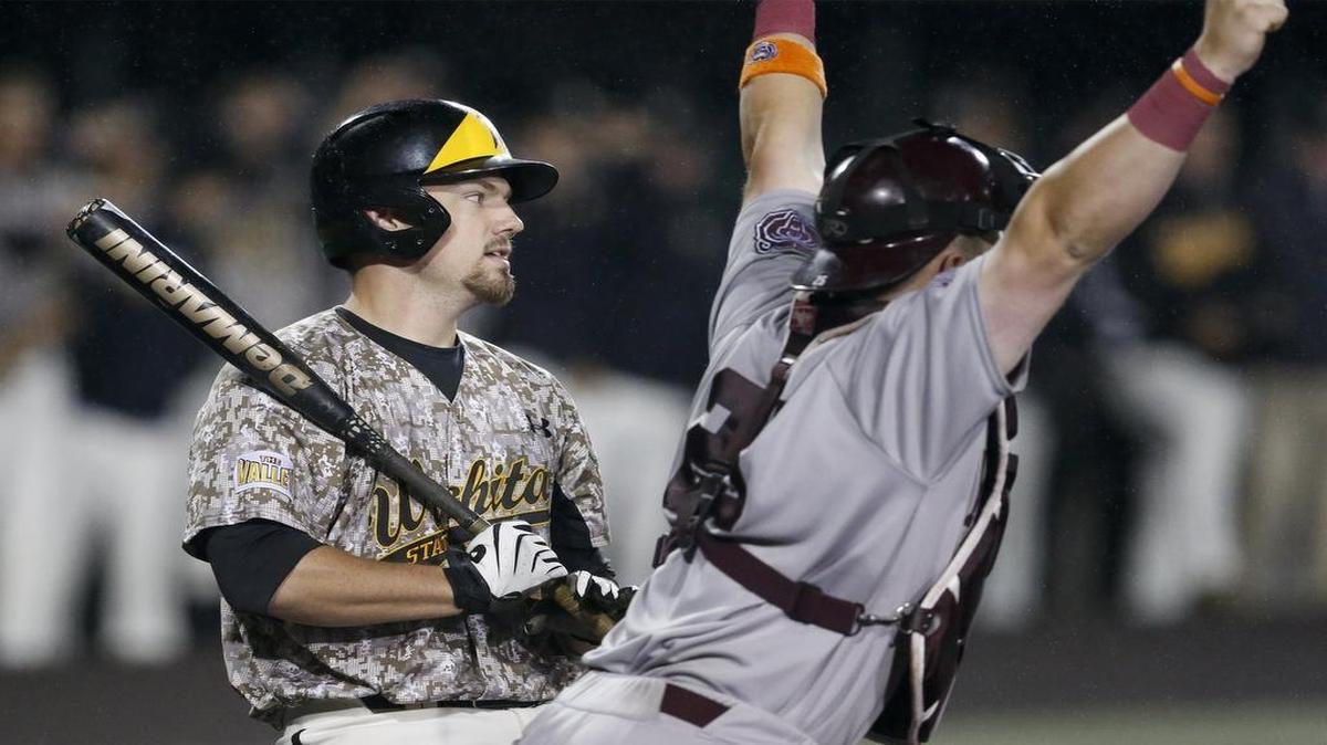 
Missouri State catcher Matt Fultz, right, celebrates as Wichita State's Bob Arens is called out on strikes to end the game Friday. 
