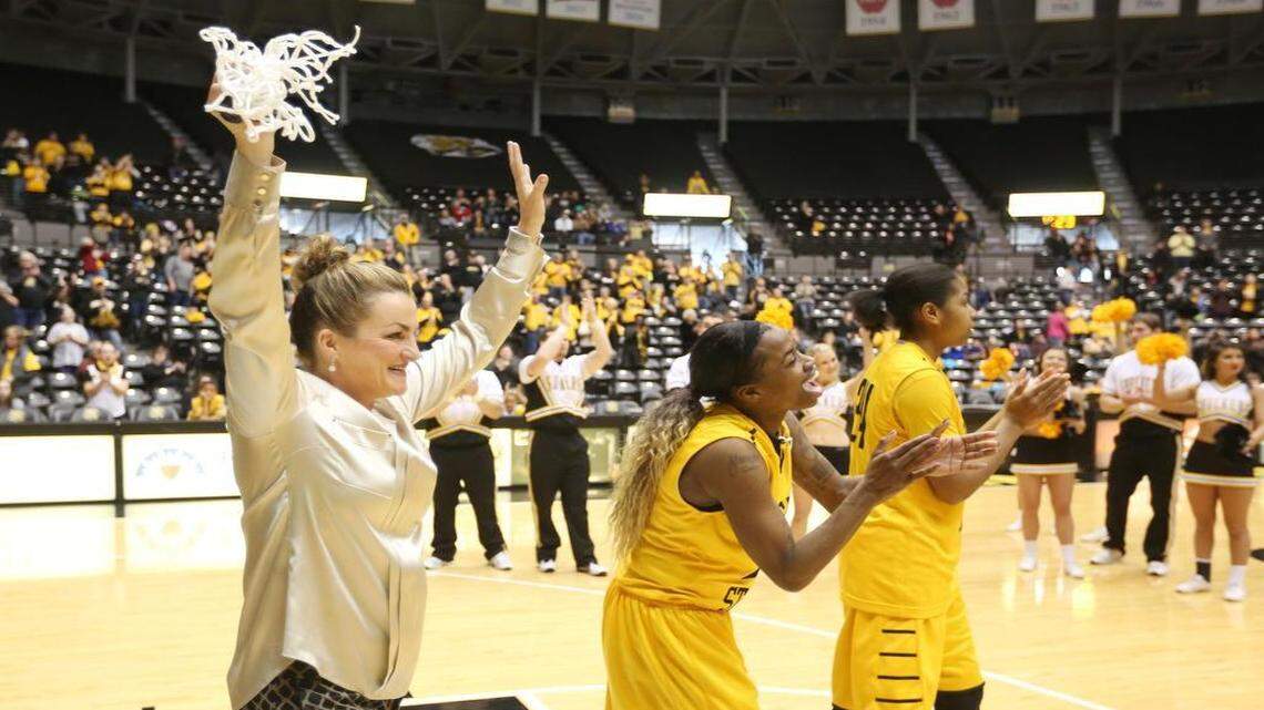 
Wichita State coach Jody Adams and seniors Jamillah Bonner and Alex Harden acknowledge the crowd after cutting down the net following WSU’s win over Northern Iowa on March 1 that clinched the regular-season MVC title.
