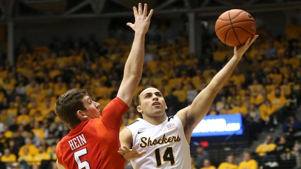 Wichita State guard John Robert Simon takes a shot against Illinois State guard Matt Hein during the second half Saturday at Koch Arena.