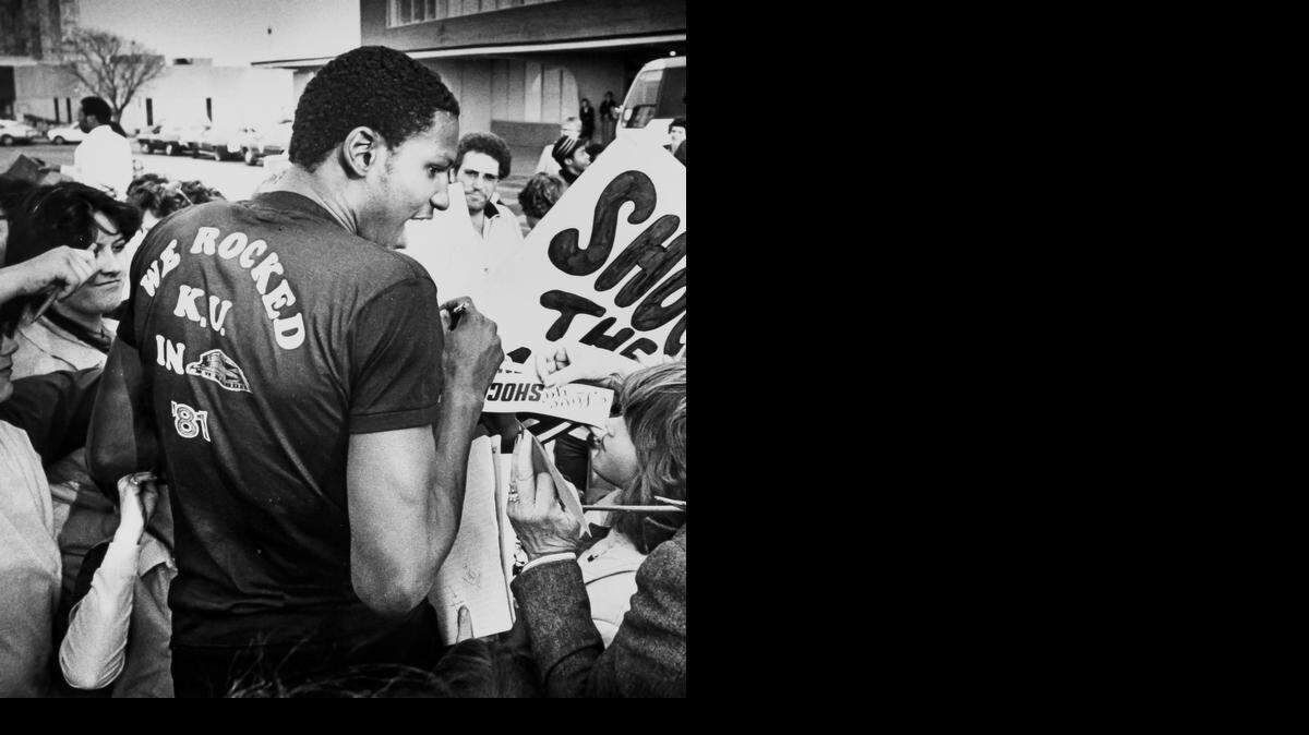 
Wichita State’s Cliff Levingston signs autographs for fans after arriving at Mid-Continent Airport. The Shockers beat Kansas in the Midwest Regional semifinal before losing to LSU in the regional final.
