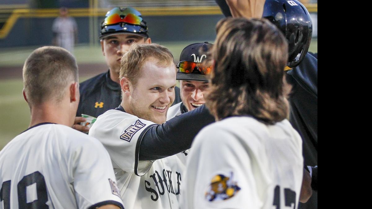 
Wichita State's Taylor Sanagorski gets congratulated after his two-run homer against Oklahoma in the third inning to cut into the Sooners' lead Tuesday at Eck Stadium.
