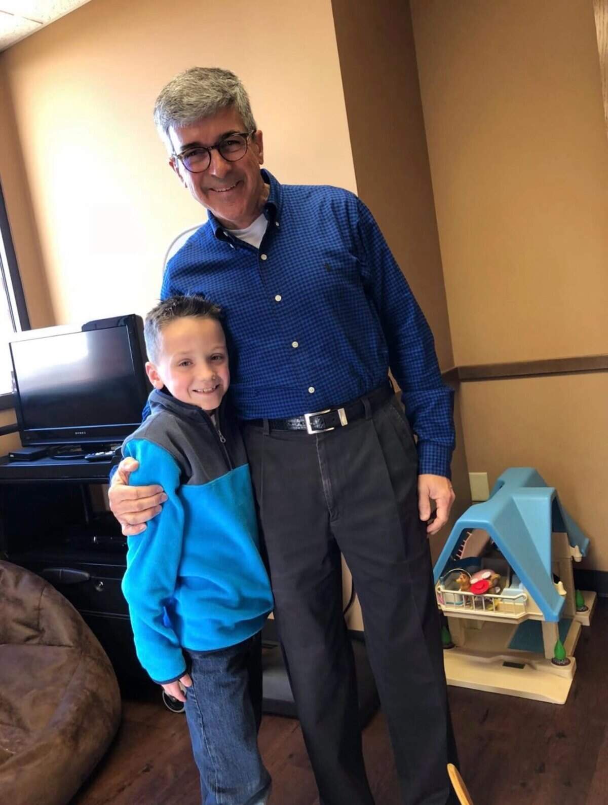 Cohen Museousky poses with Dr. David Rosen on the day he received the all-clear after his battle with leukemia, about six years after he was first diagnosed at 20 months old. Museousky, now a Goddard sophomore, is tied for the lead after the first day of the Class 5A state boys golf tournament.