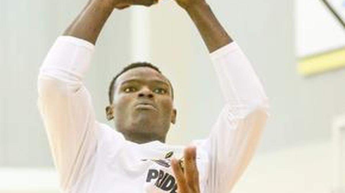 
Wichita State's Bush Wamukota shoots over Darius Carter during a pickup game in the Shockers practice facility in June.
