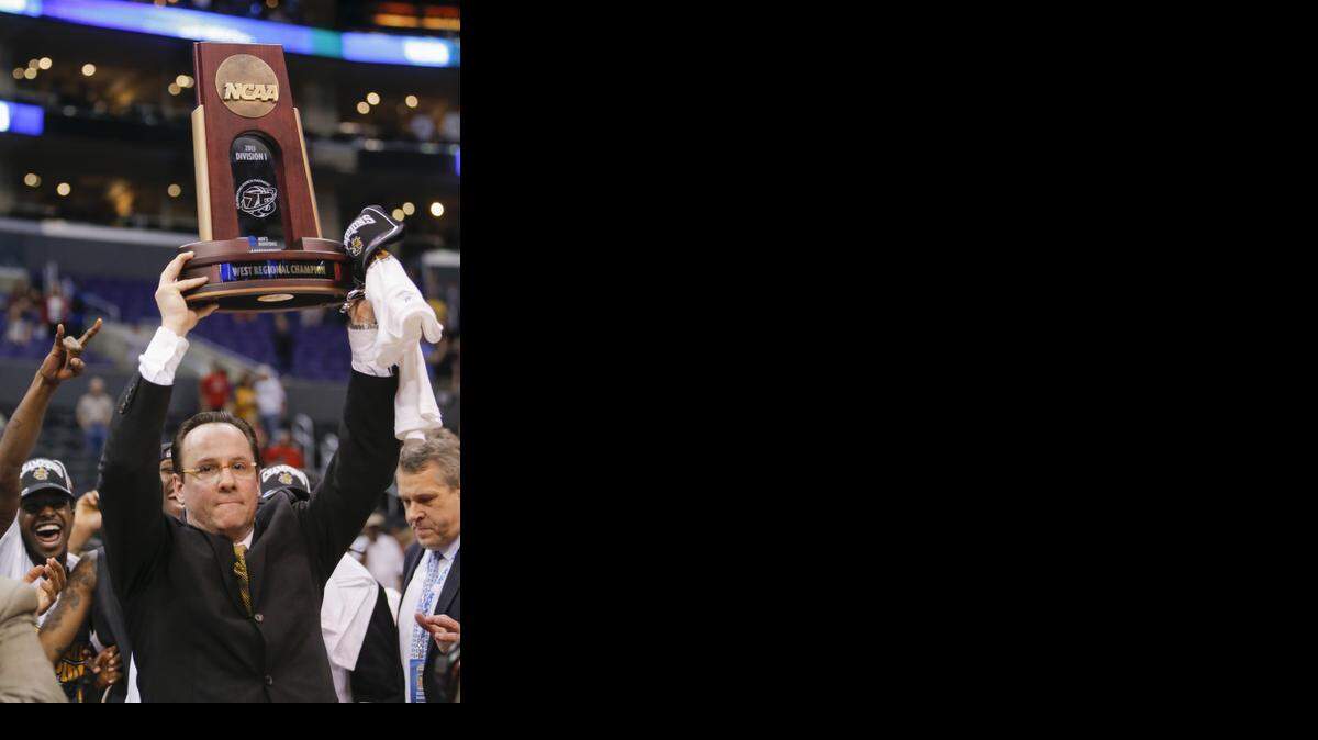 
Gregg Marshall, holding the 2013 NCAA West Regional trophy, has Wichita State on its way to being in the conversation for an MVC dynasty.
