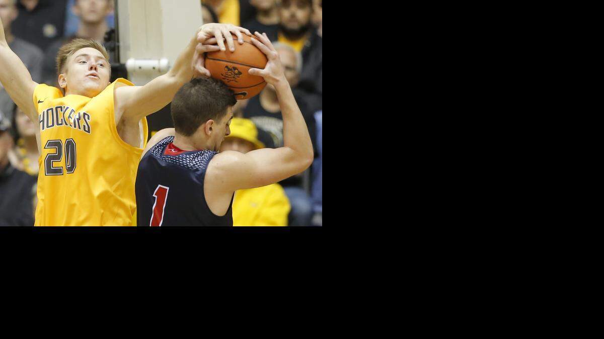 
Wichita State's Rauno Nurger blocks the shot of Newman University's Luka Vermezovic during the first half of their game at Koch Arena on Sunday. 
