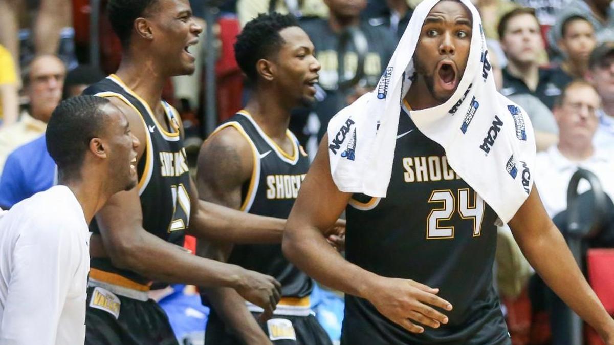 The Wichita State bench reacts after a Fred VanVleet three-pointer late in the second half Tuesday against Dayton.