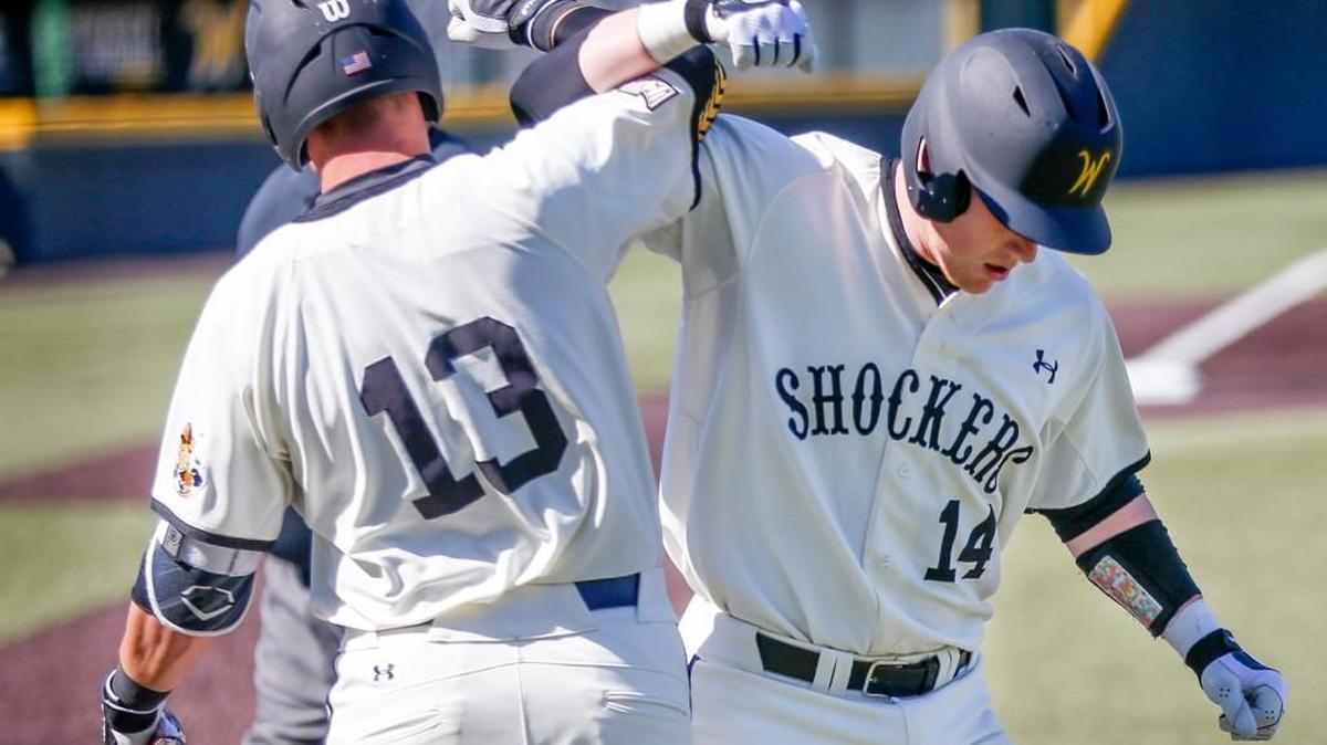Wichita State's Gunnar Troutwine, right, gets congratulated by teammate Chase Rader after Troutwine's homer tied the game against Bradley last April 23.