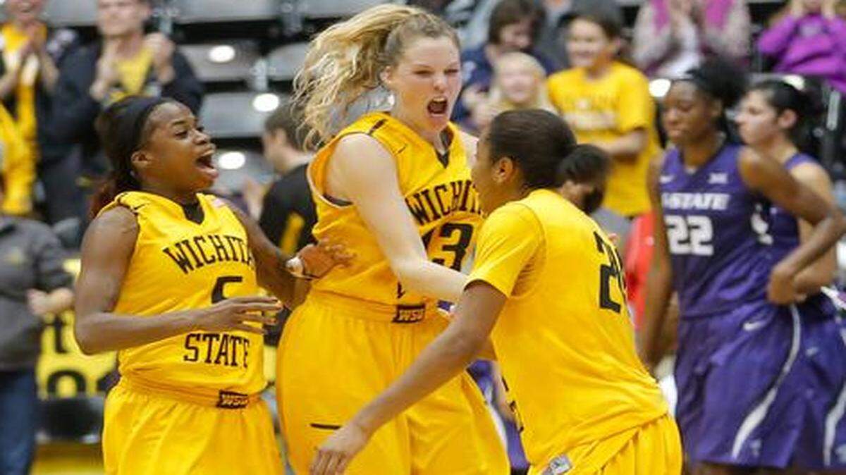 
Wichita State's Jamillah Bonner, left, Kelsey Jacobs and Alex Harden celebrate a win over Kansas State in December. Jacobs is an inside presence for WSU’s offense.

