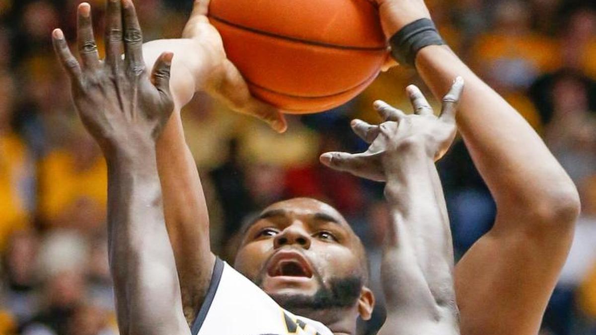 Wichita State’s Shaq Morris shoots over Southern Illinois’ Abby Djimde last season at Koch Arena.
