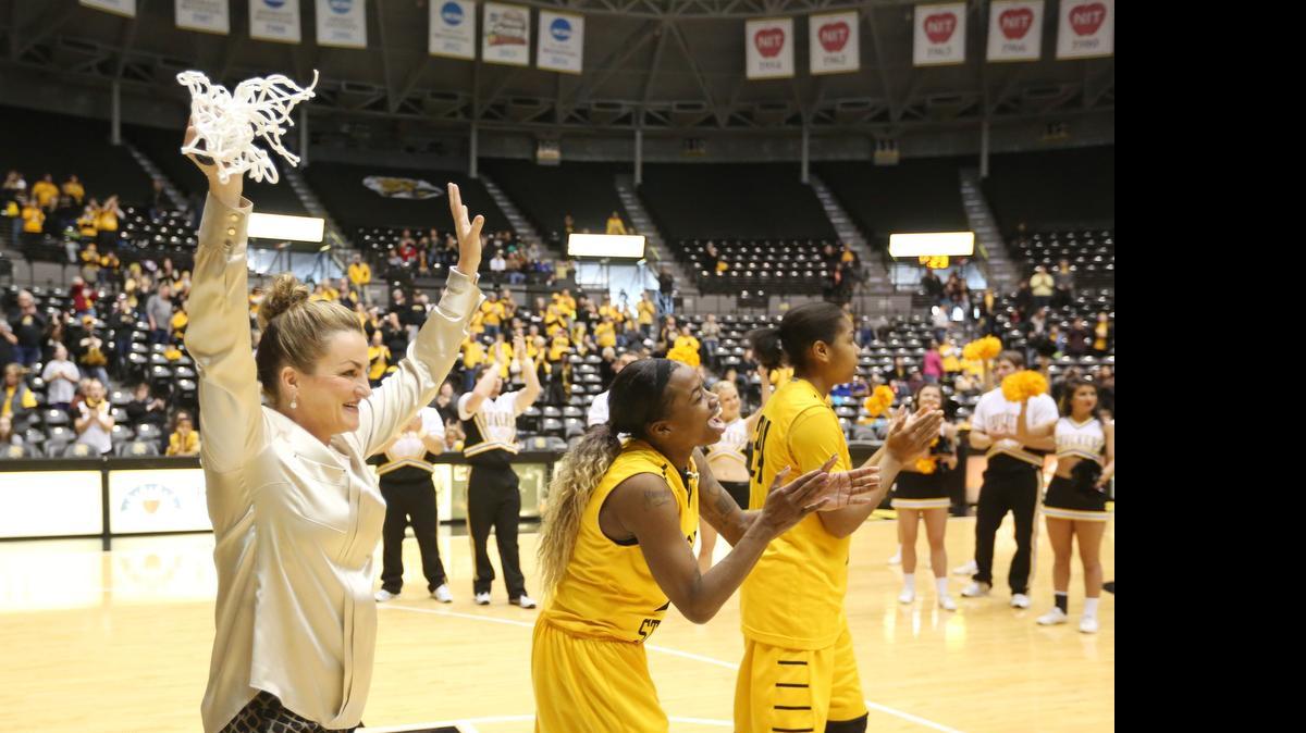 
Wichita State coach Jody Adams celebrates after cutting down the net following the team clinching a share of the MVC title on March 1.
