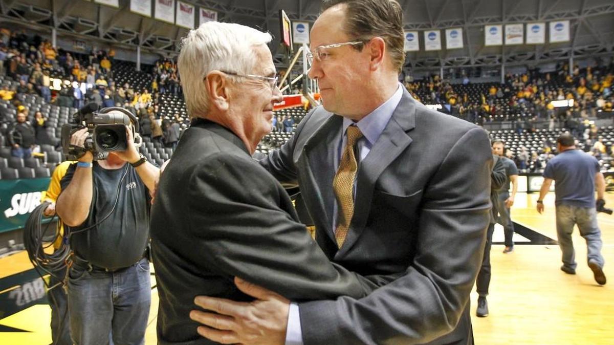 Wichita State coach Gregg Marshall, right, gets a hug from WSU president John Bardo after his victory over Southern Illinois made him the winningest coach in WSU history at Koch Arena Wednesday. (Feb 3, 2016)