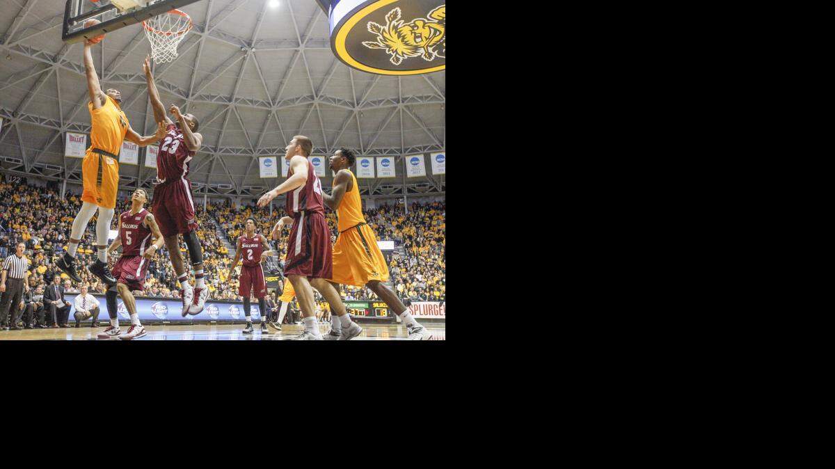 
Wichita State's Darius Carter dunk on Southrn Illinois’ Bola Olaniyan in the first half Wednesday at Koch Arena.
