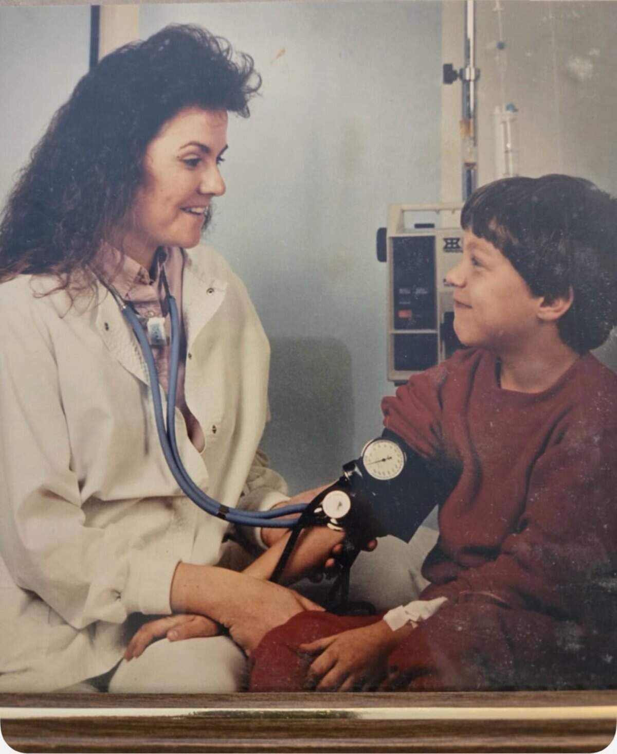 Jim Zimmer is shown as a boy with a nurse at Dr. David Rosen’s Wichita office during his own leukemia treatments. Decades later, Zimmer became the Goddard golf coach for Cohen Museousky, another leukemia survivor treated by Rosen.