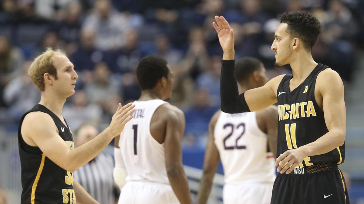 Wichita State’s Conner Frankamp and Landry Shamet high-five after Frankamp scored a three-point goal in the final minutes of their game against Connecticut at the XL Center in Hartford, Conn. It was the first game for Wichita State in the American Athletic Conference.