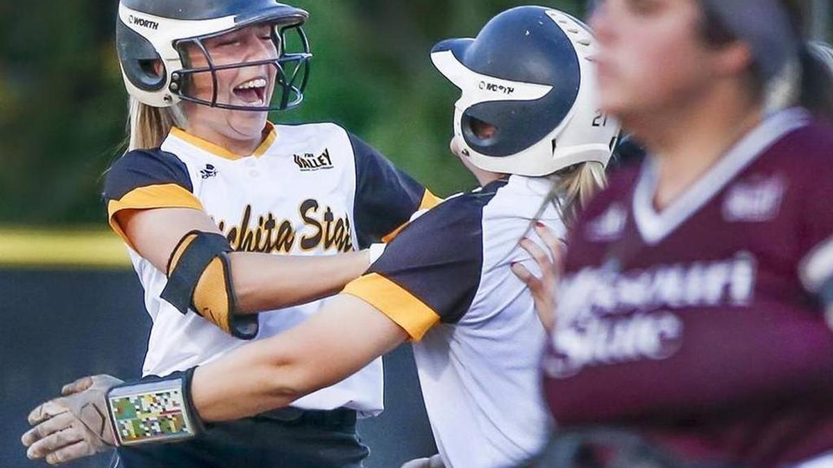 Wichita State's Kelli Spring, left, is congratulated by teammate Cacy Williams after Spring's game-winning hit in the bottom of the seventh inning beat Missouri State 5-4 at Wilkens Stadium on Tuesdasy.