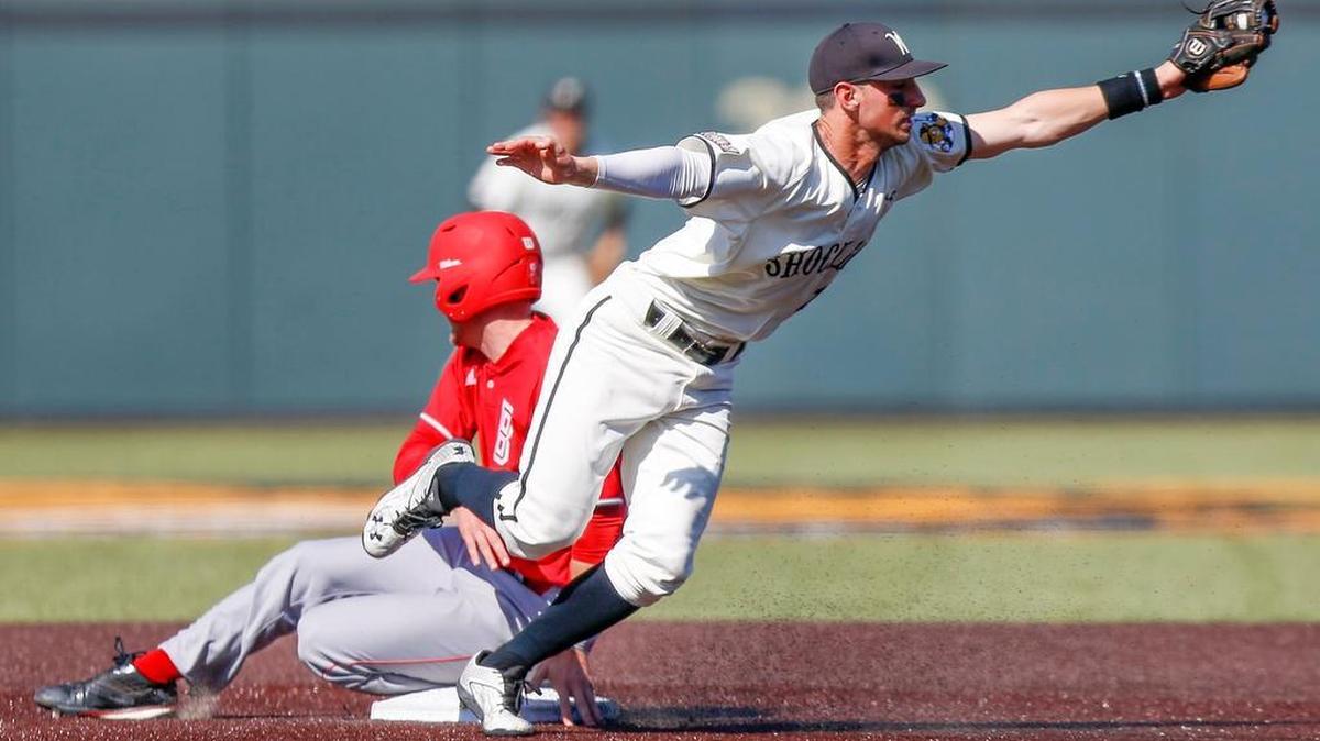 Bradley’s Nick Green slides into second base safely as Wichita State’s Trey Vickers gets pulled off the bag on a bad throw from pitcher John Hayes in the ninth inning Saturday at Eck Stadium.