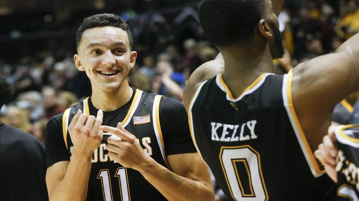 Wichita State's Landry Shamet points to his ring finger after the Shockers clinched a share of the MVC title by defeating Missouri State.