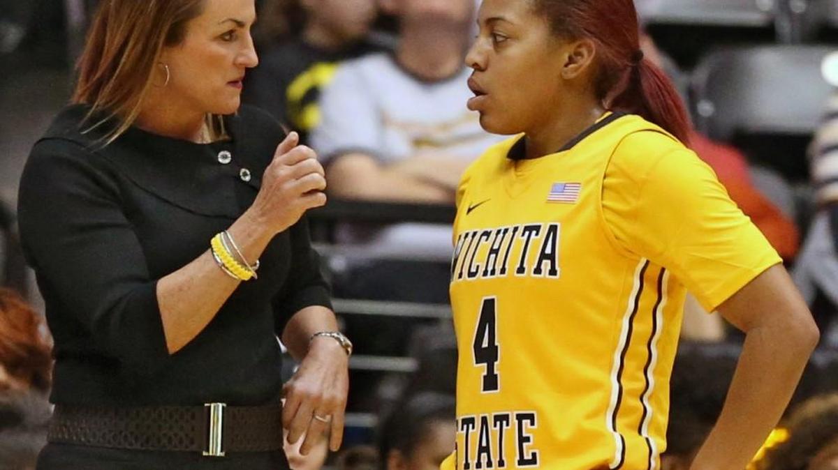 WSU women’s coach Jody Adams-Birch talks with guard Diamond Lockhart during a game last season