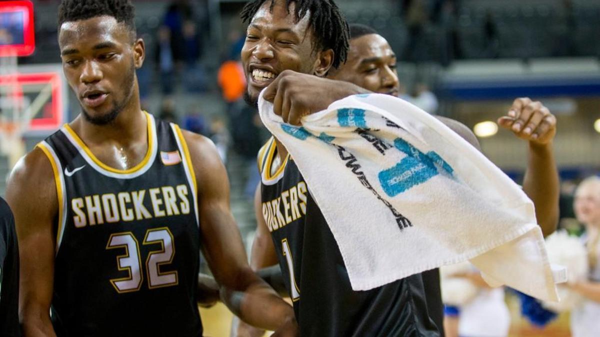 Wichita State forward Zach Brown, right, celebrates Markis McDuffie after WSU’s victory at Drake on Wednesday night.