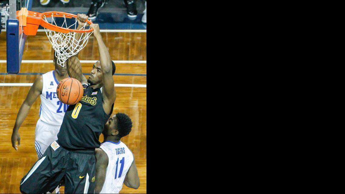 
Wichita State's Rashard Kelly throws down a dunk against Memphis during the second half on Mov. 18 in Sioux Fall, SD.
