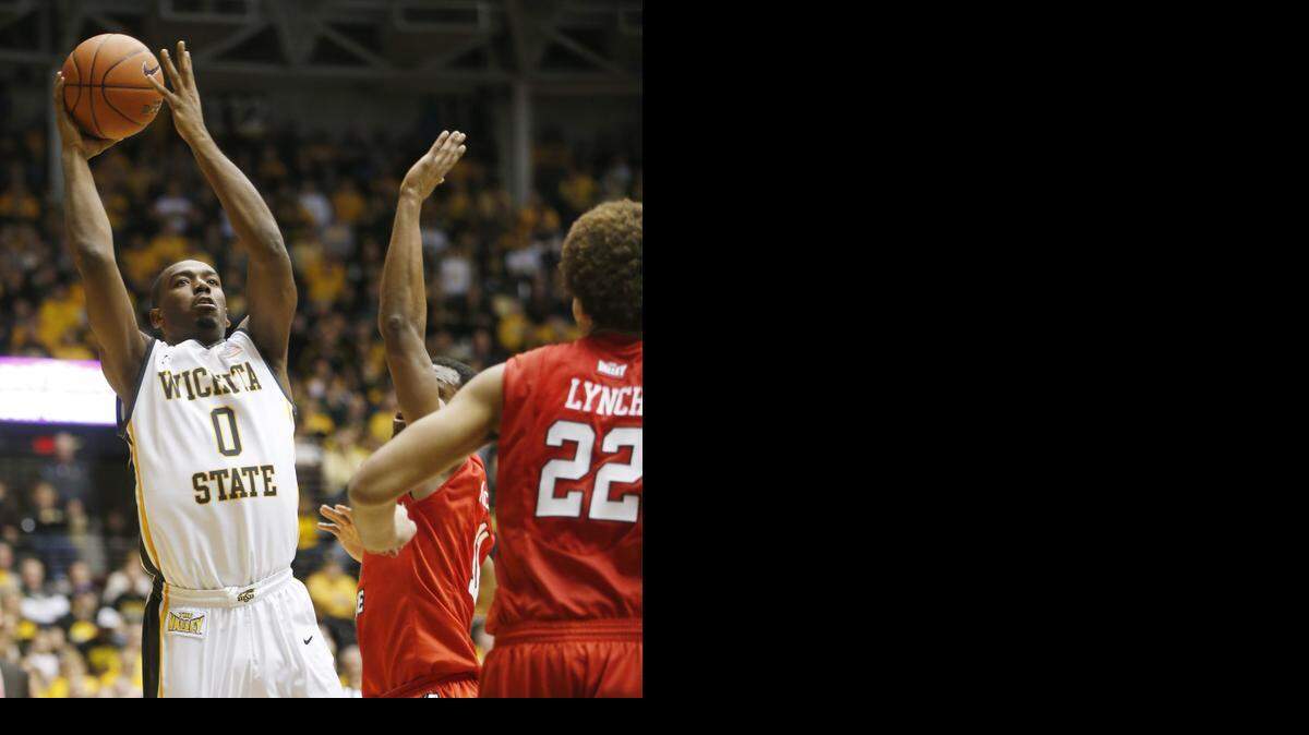 
Wichita State University's Rashard Kelly shoots against Illinois State in the first half on Sunday at Koch Arena. (Jan. 4, 2015)
