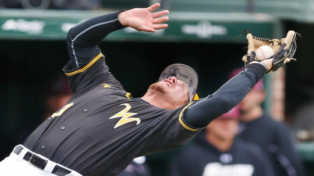 Wichita State third baseman Chase Rader has to bend backwards as he catches a foul ball against Southern Illinois last May.