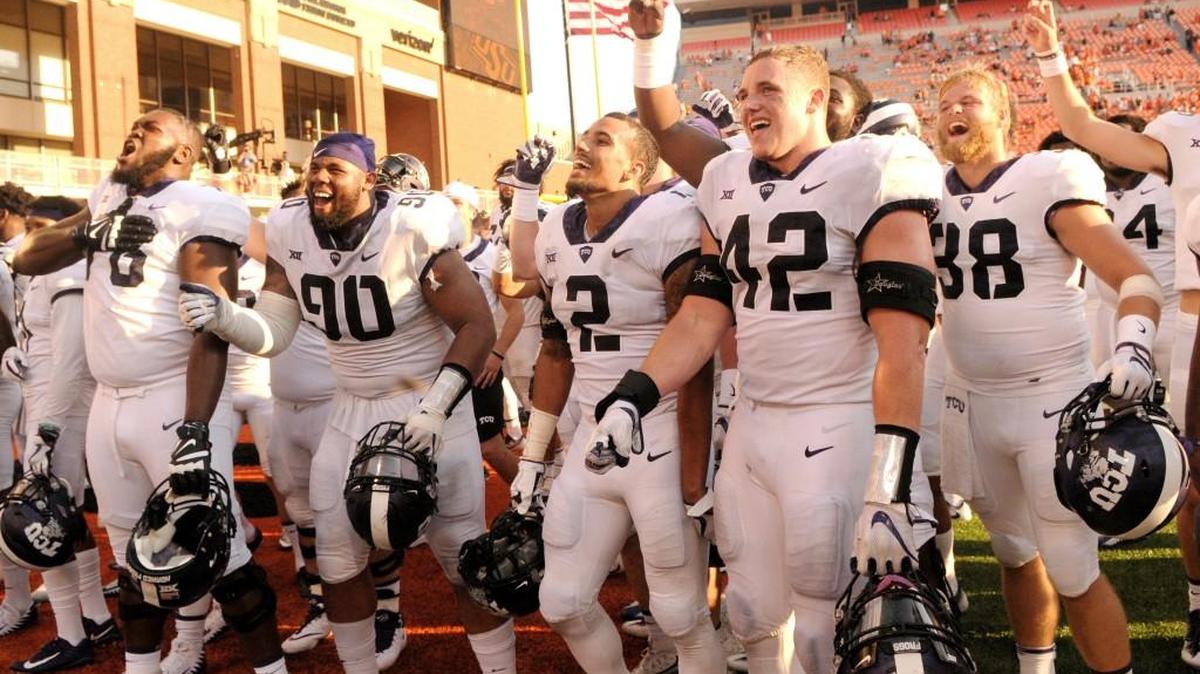 TCU players celebrate with fans in the end zone of Boone Pickens Stadium in Stillwater, Okla., Saturday, Sept. 23, 2017. TCU defeated Oklahoma State 44-31.(AP Photo/Brody Schmidt)
