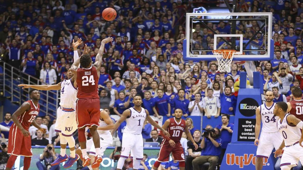 Oklahoma guard Buddy Hield hits a three-pointer in triple over against Kansas during their game at Allen Fieldhouse on Monday night.