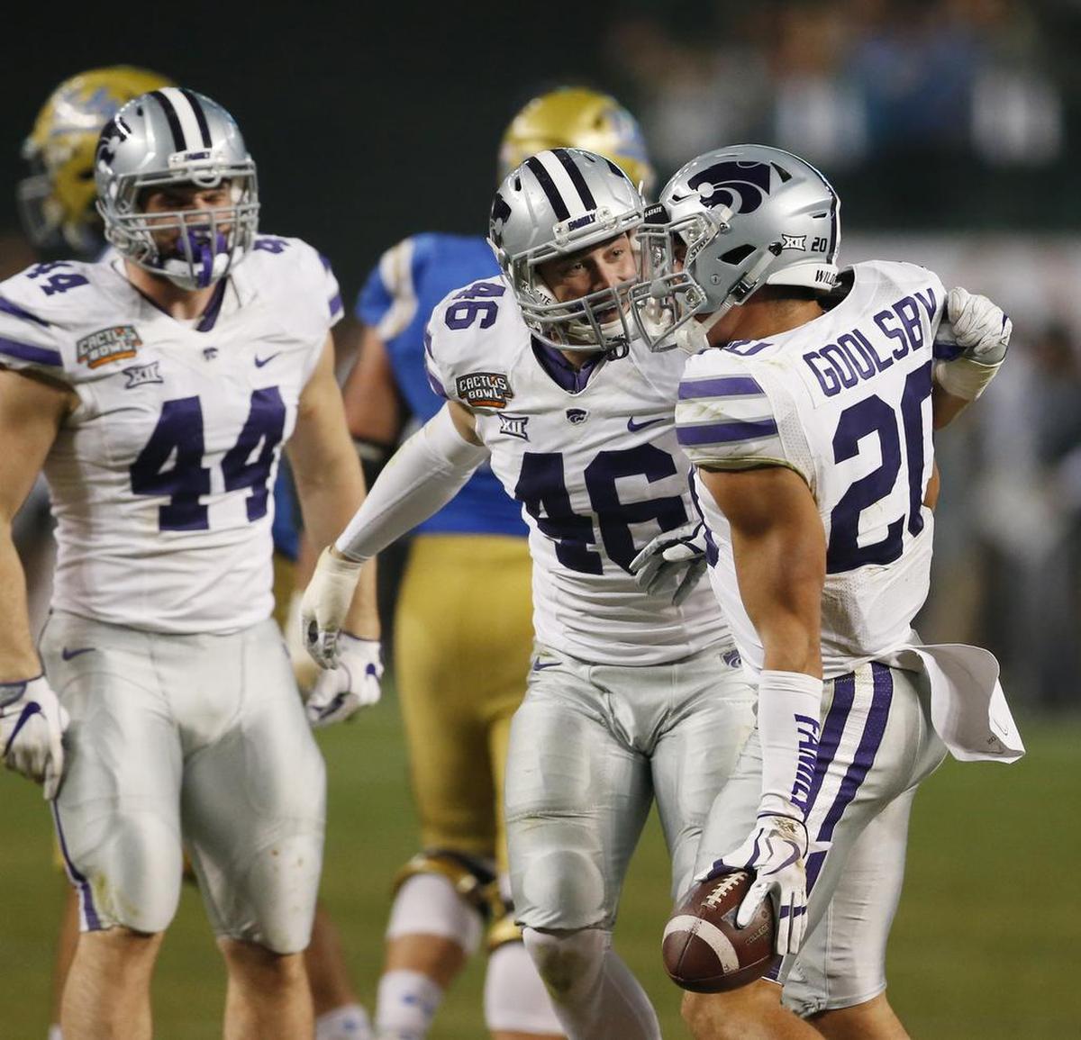 K-State defensive back Denzel Goolsby (20) celebrates after forcing a UCLA fumble, a play Coach Bill Snyder called key to winning the game. (Dec. 26, 2017)