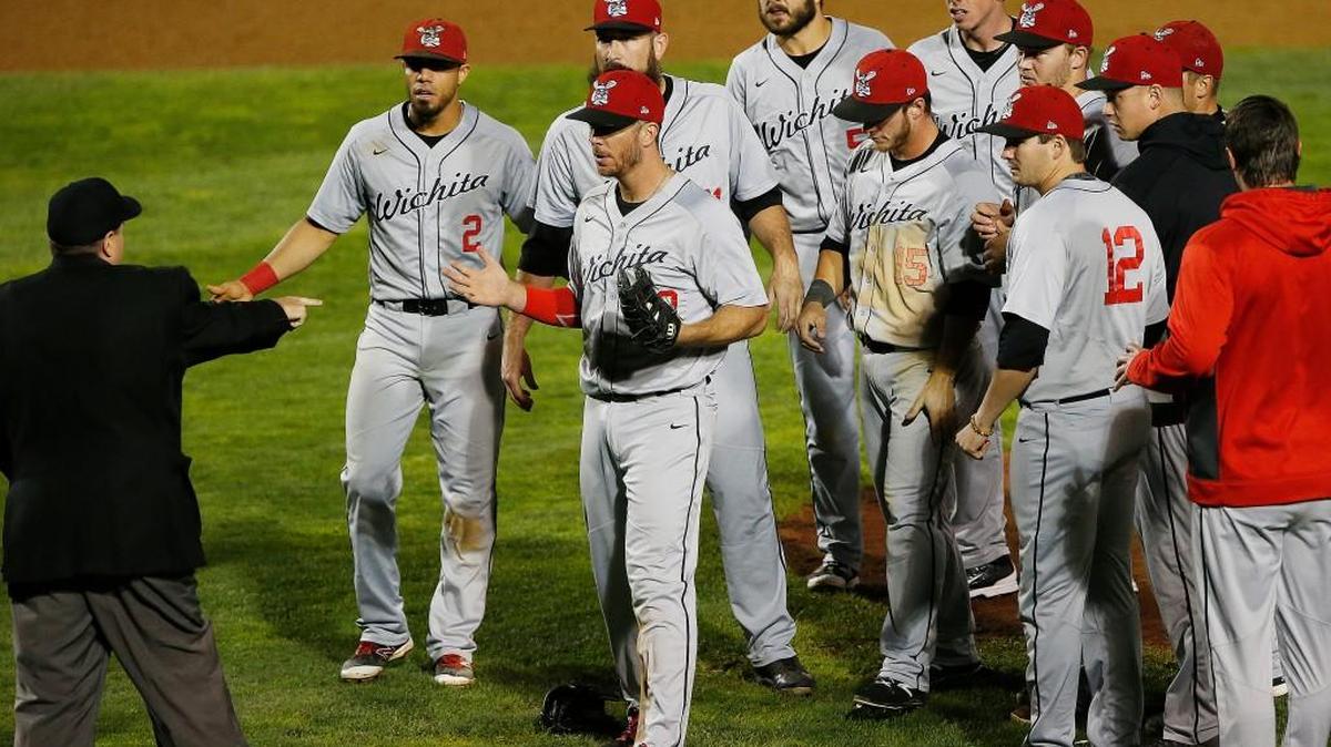 Wingnuts players react as the umpire tells them that pitcher Ryan Kussmaul (11) balked with two outs in the ninth inning on Monday. Instead of ending the game with a groundball, Winnipeg tied the score 3-all and won 4-3 in 17 innings.