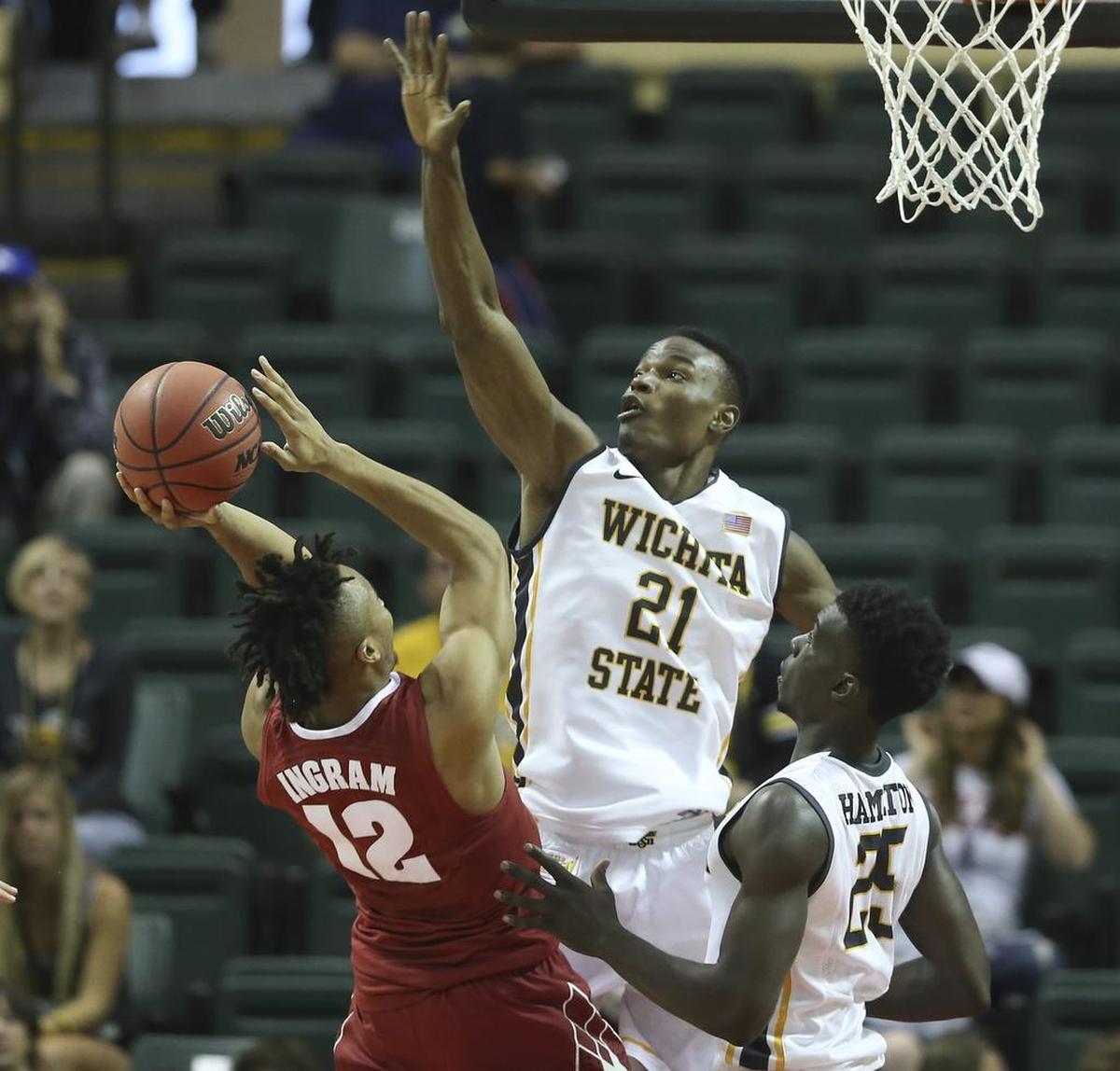 Wichita State center Bush Wamukota tries to stop Alabama guard Dazon Ingram from getting a basket during the first half of their game at the AdvoCare Invitational in Orlando on Friday.