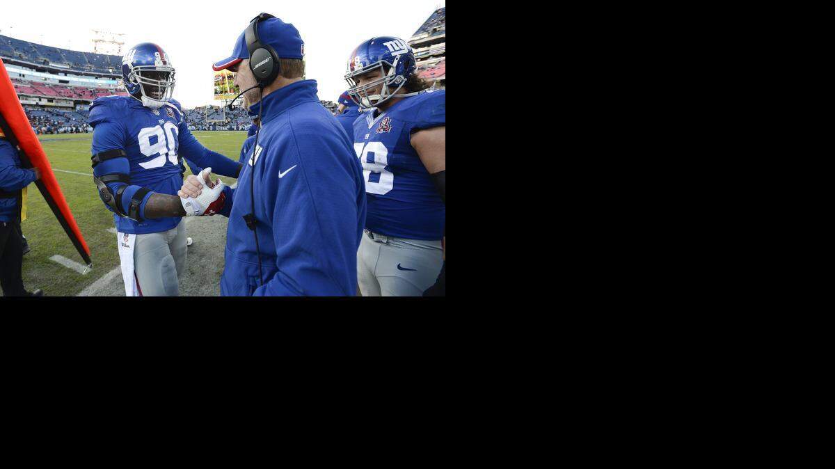 
Former Fort Scott Community College standout Jason Pierre-Paul, left, had two sacks for the Giants against the Titans on Sunday.
