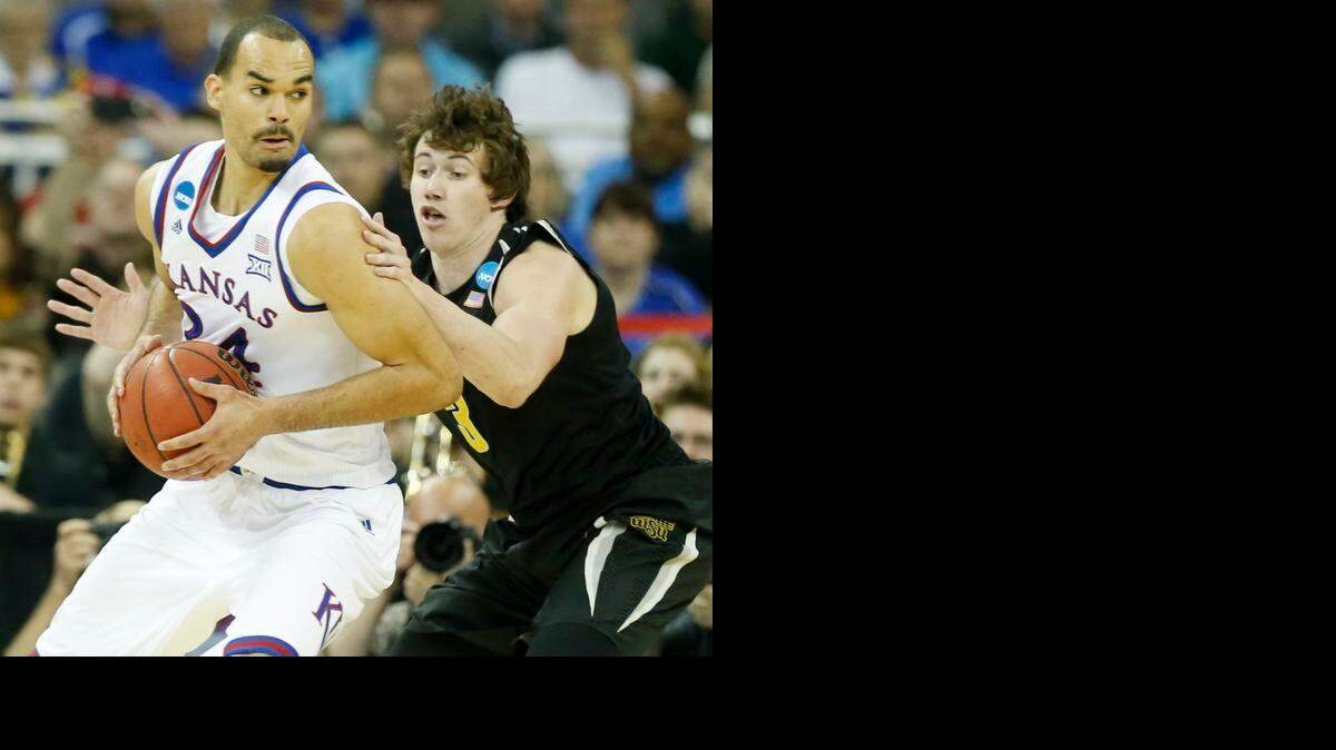 
Wichita State guard Evan Wessel defends Kansas forward Perry Ellis in the NCAA Tournament at CenturyLink Center in Omaha. 
