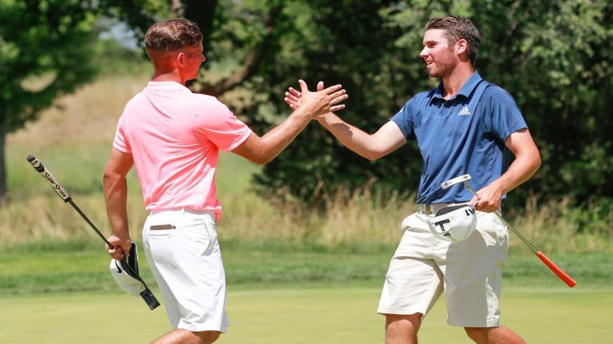 Noah Goodwin, left, shakes hands with Matthew Wolff after Goodwin won on the 36th hole during the final round of match play at the 2017 U.S. Junior Amateur at Flint Hills National in Andover on Saturday.