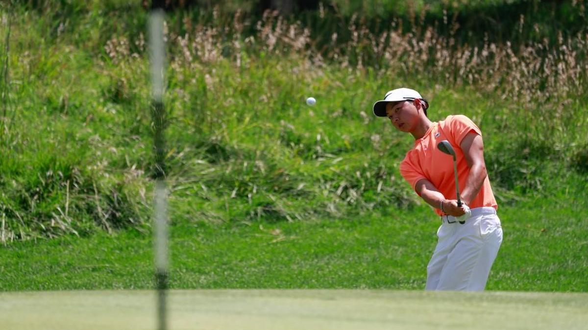 Defending champion Min Woo Lee plays a shot on the 15th hole during the first round of match play Wednesday at the U.S. Junior Amateur at Flint Hills National Golf Club in Andover. Lee lost to Noah Norton 2 and 1.
