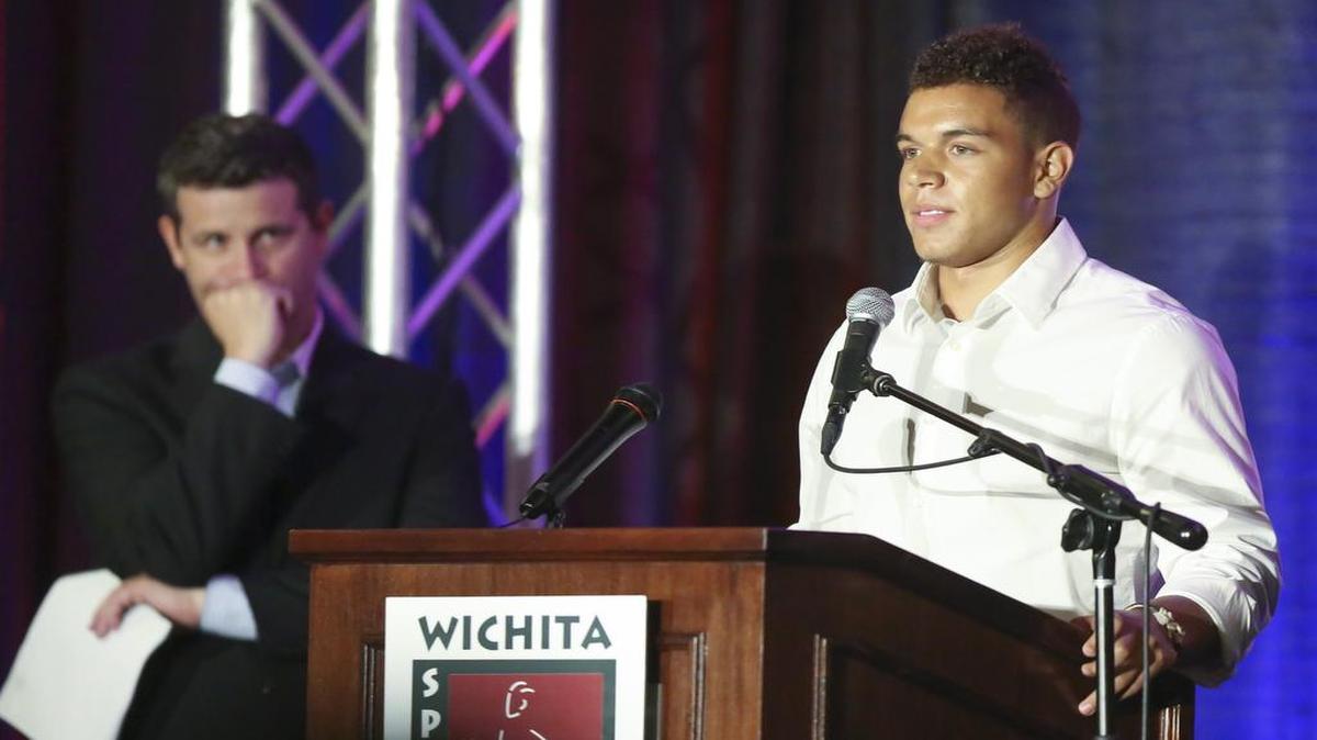 
Denzel Goolsby, a recent graduate of Bishop Carroll who will play for Kansas State, talks about his father while accepting the award for Male High School Athlete of the Year on Thursday night. 

