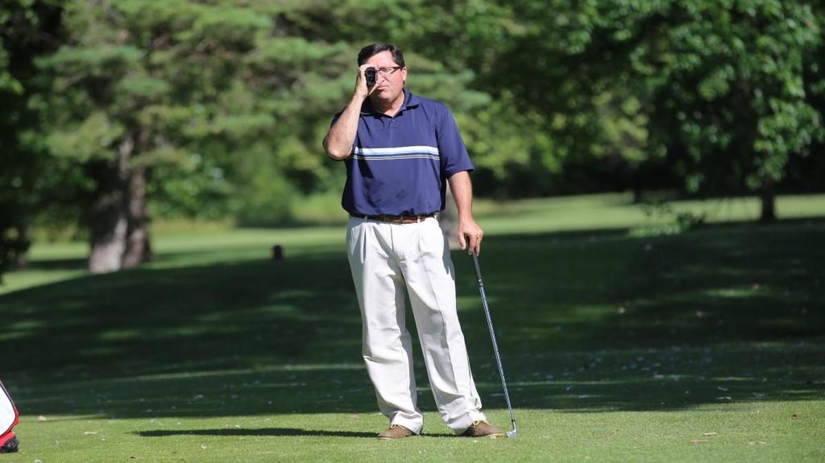 Crestview Country Club assistant pro Brad Kipper uses a rangefinder to calculate the distance on a par 3 hole. Golfers will be allowed to us the device during the Air Capital Classic.