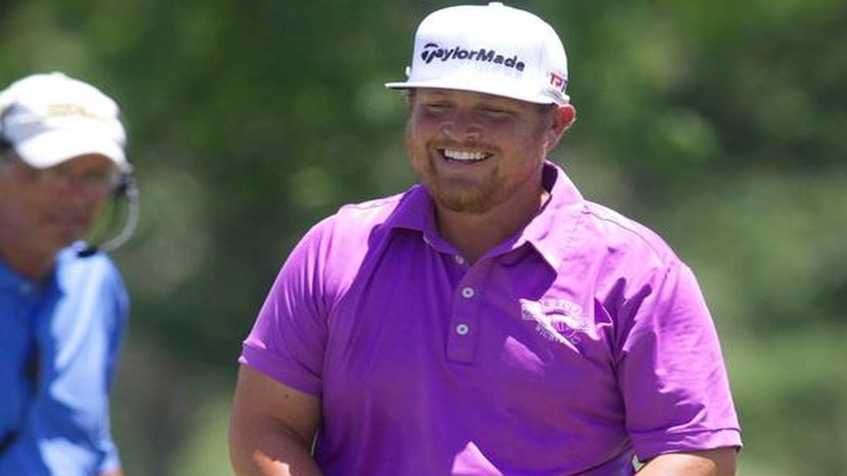 
Former Wichita State player Ryan Spears laughs on the green at No. 9 on Thursday during the first round of the Air Capital Classic at Crestview Country Club. 
