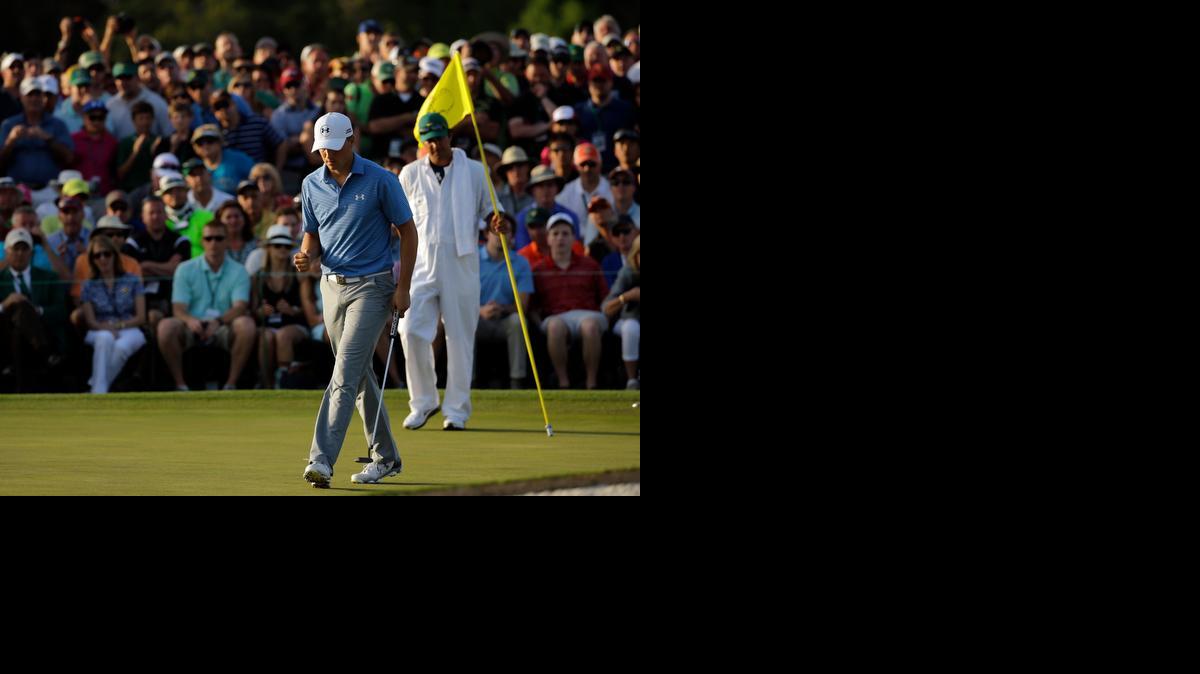 
Jordan Spieth pumps his fist after making par on the 18th hole during the third round of the Masters on Saturday in Augusta, Ga. 
