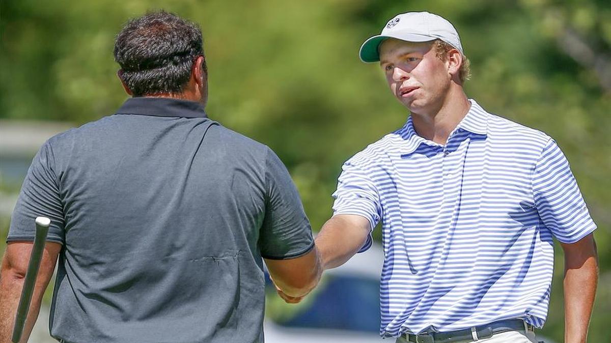 
Sam Stevens, right, shakes hands with Spencer Christian after Stevens won on the 19th hole of their match Friday afternoon in the Kansas Amateur Match Play Championship at the Wichita Country Club. 
