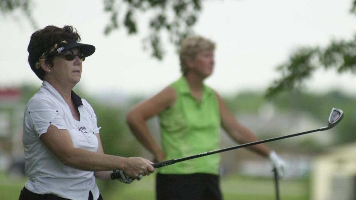 Denise Desilet tees off in the 2006 Wichita city women’s match-play tournament, as Paula Routon looks on. Routon won that year and each woman has won six city match-play titles.
