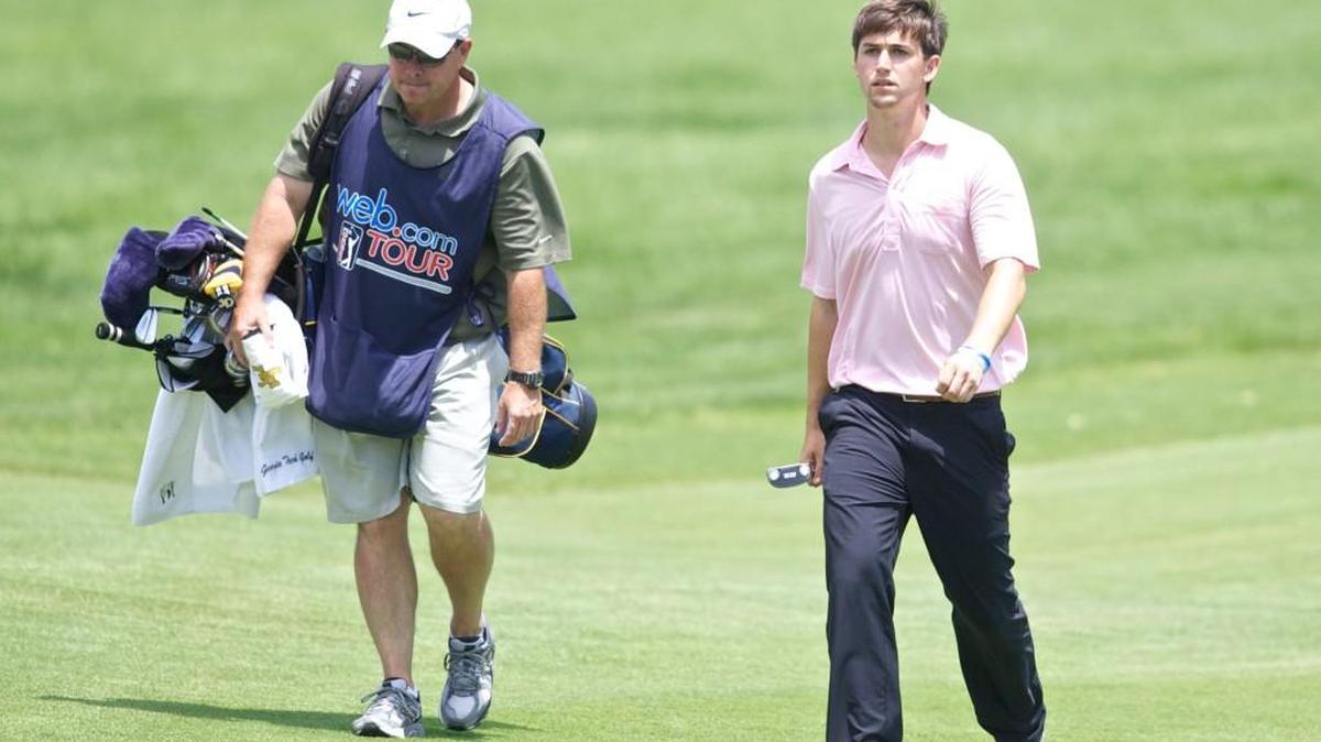 Ollie Schniederjans walks up to the green on hole No. 18 during the first round of the Air Capital Classic at Crestview Country Club in 2014.