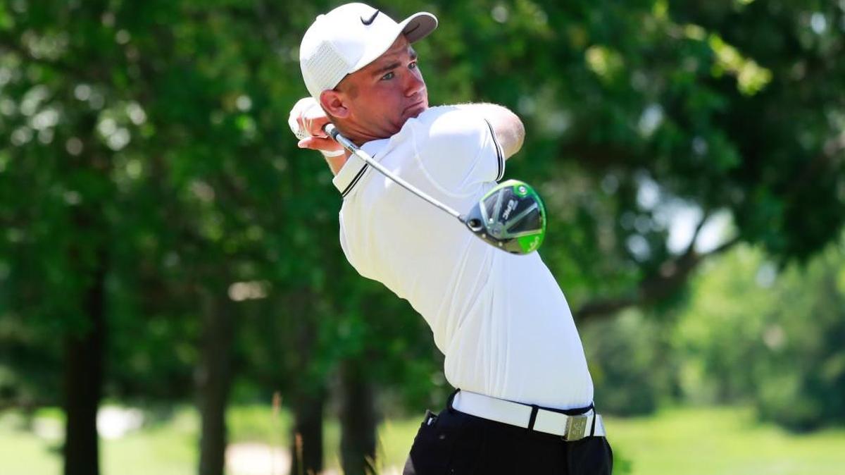 Noah Goodwin watches his tee shot on the first hole during the semifinal round of match play at the U.S. Junior Amateur at Flint Hills National.