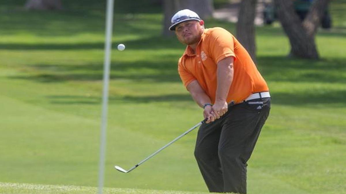 Ryan Spears chips onto the green of No 18 during the first round of the Air Capital Classic on Thursday at Crestview Country Club.