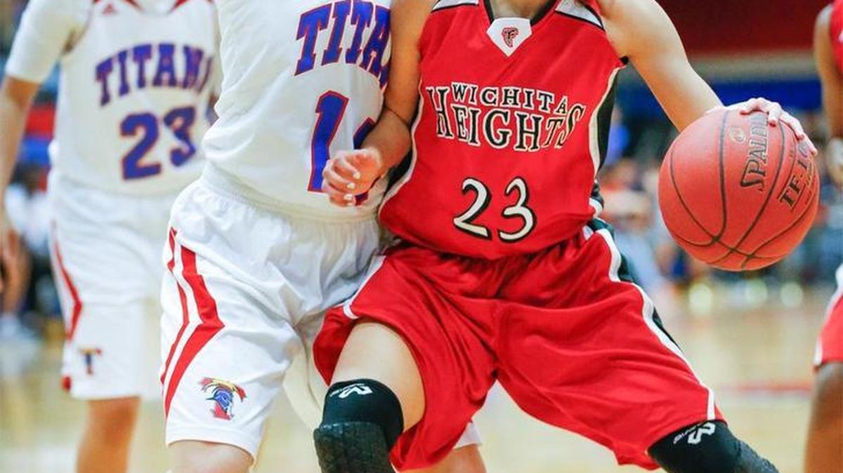 South’s Ericka Mattingly, left, defends Heights’ Trinity Conley.