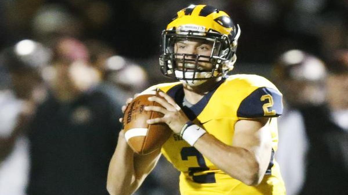 
Northwest quarterback Kevin Folsom looks for a receiver during Friday’s game against West. 
