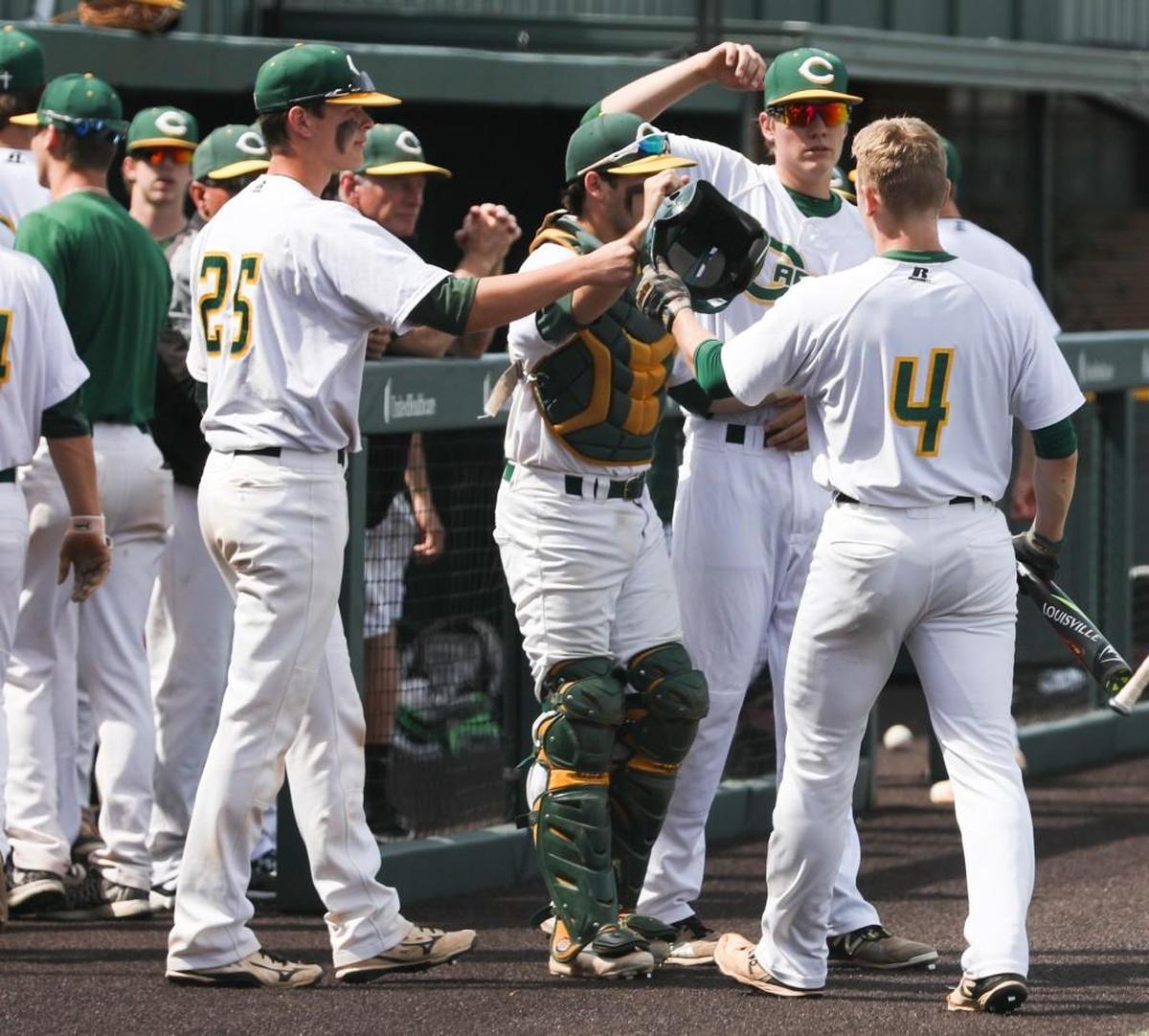 Bishop Carroll’s Blake Freeman (4) celebrates with the dugout after scoring in the first inning against Blue Val ley Southwest during the Class 5A State baseball quarterfinals in Eck Stadium. (May 25, 2017)